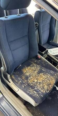 Front seat with dried residue buildup before cleaning